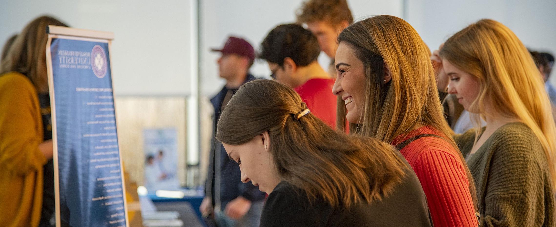 Students learn about all the opportunities available to them after graduation during a career fair hosted by Aspire计划. 的Aspi...